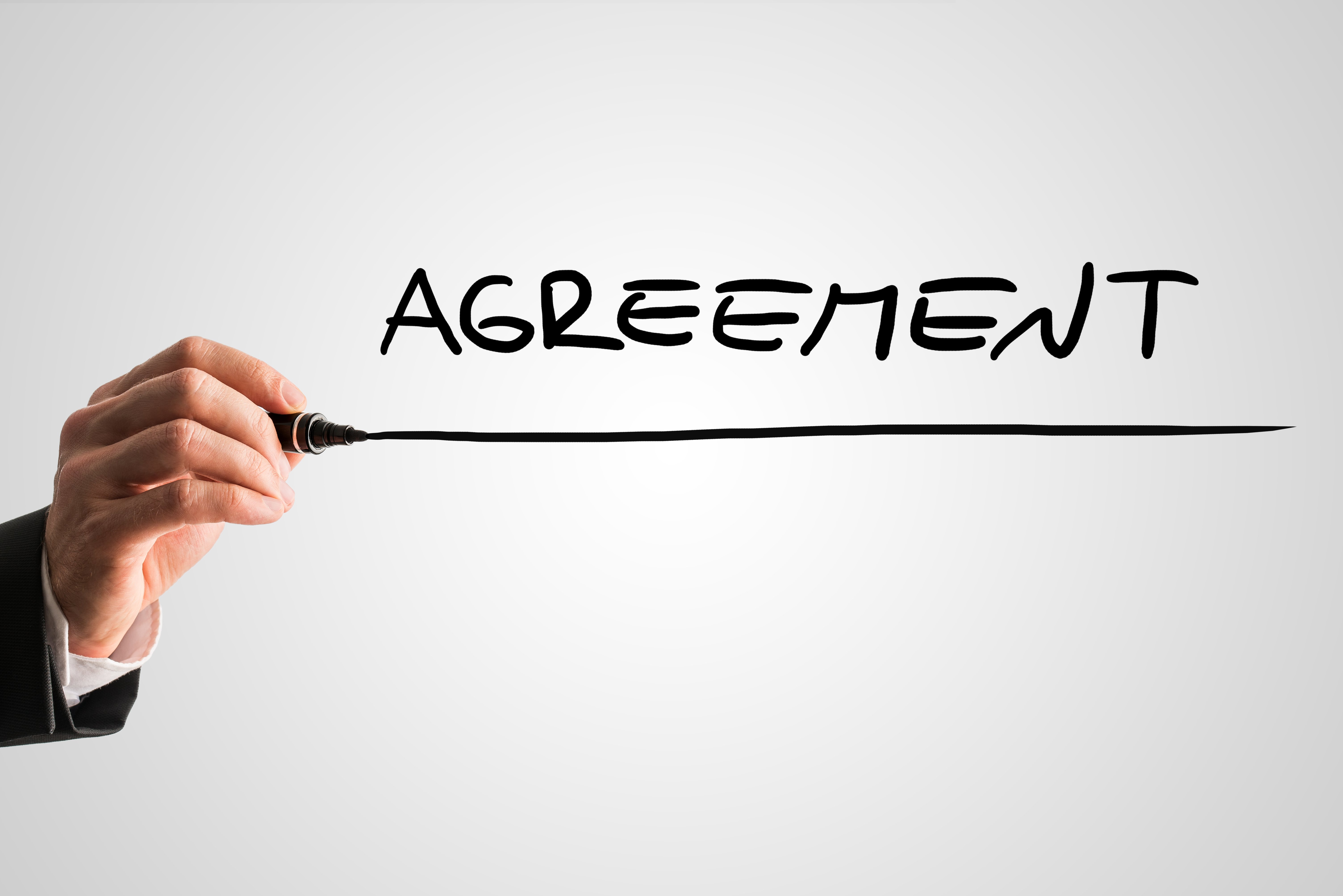 Conceptual image with the word Agreement | Trueman Brown